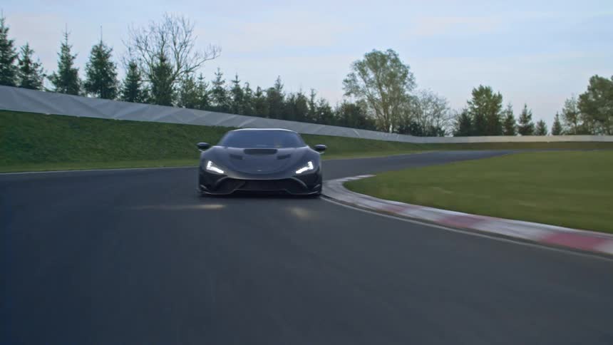 A car is driving on a racetrack