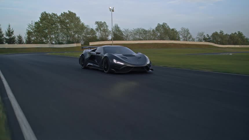 A person racing a car around a track