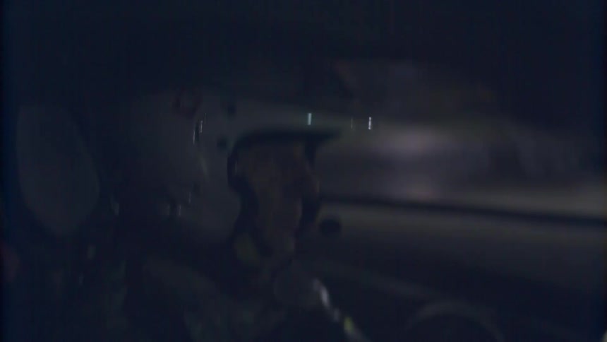 A man racing in a car