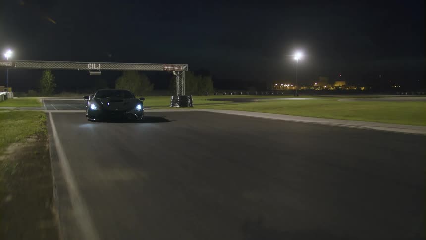 Super car on a race track driving around