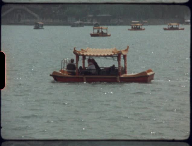 A boat on the water with passengers during daylight