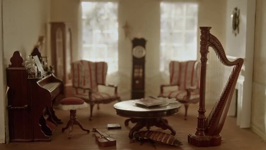 A surreal image of a giant insect in a home