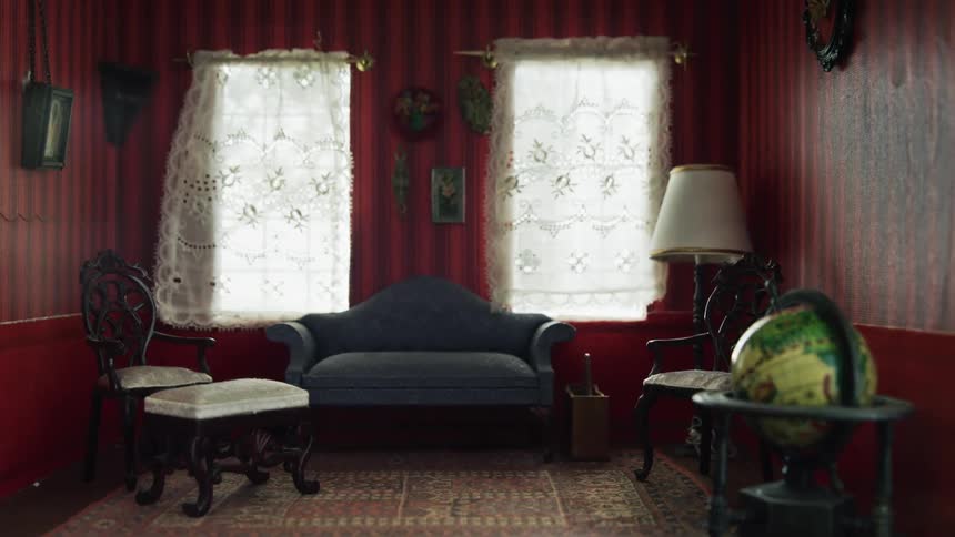 Close up of the interior of a miniature room with furniture