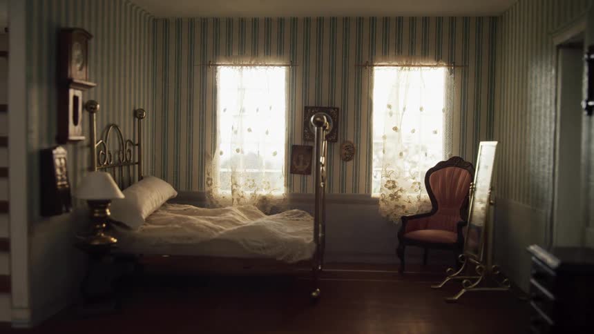 A retro styled bedroom in a house during the day