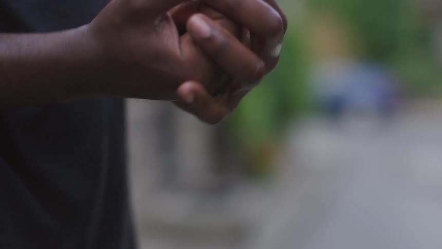 A man pumps hand sanitizer in to his hands and rubs them together