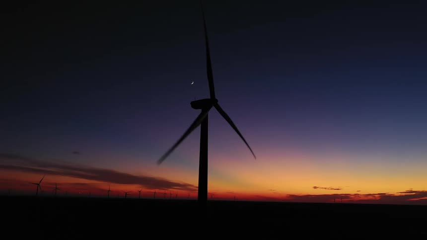 The sun is setting in a rural area