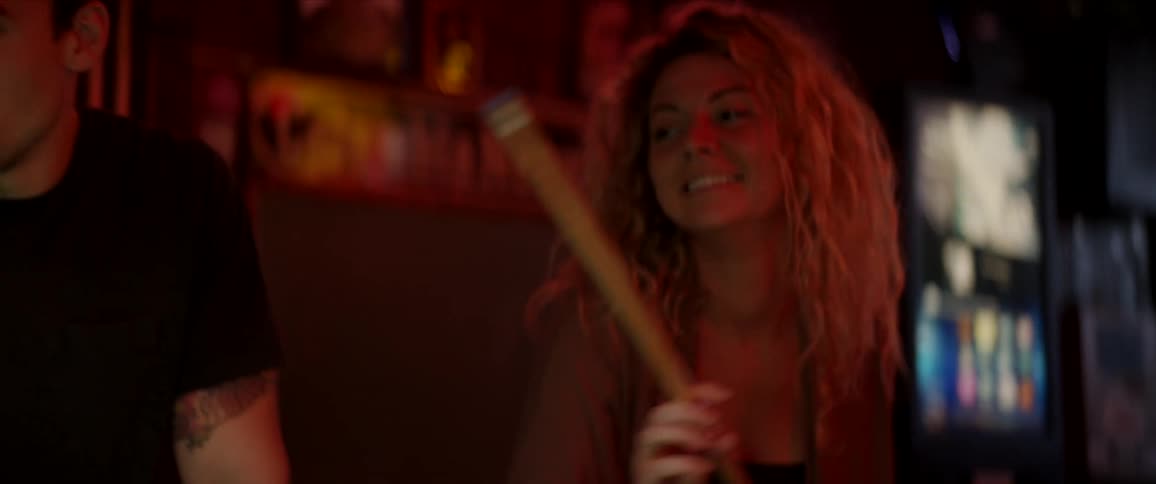 A group of friend playing pool in a bar
