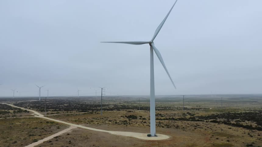 Wind turbines turning out in a large desert