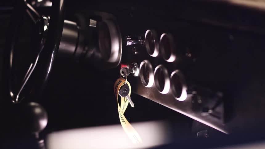 Keys dangling from the ignition of a car