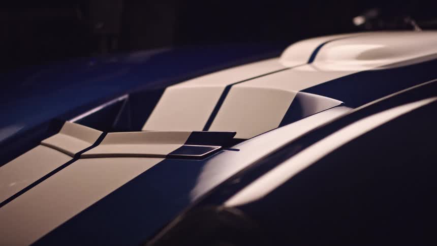 Light reflecting off the hood of a sports car