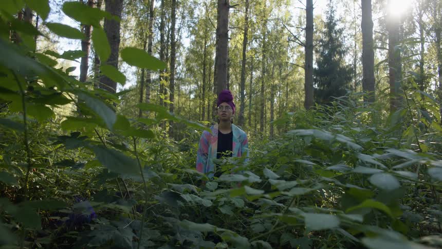 Woman having an allergic reaction in the forest