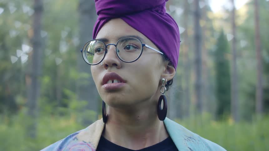Woman having an allergic reaction in a forest