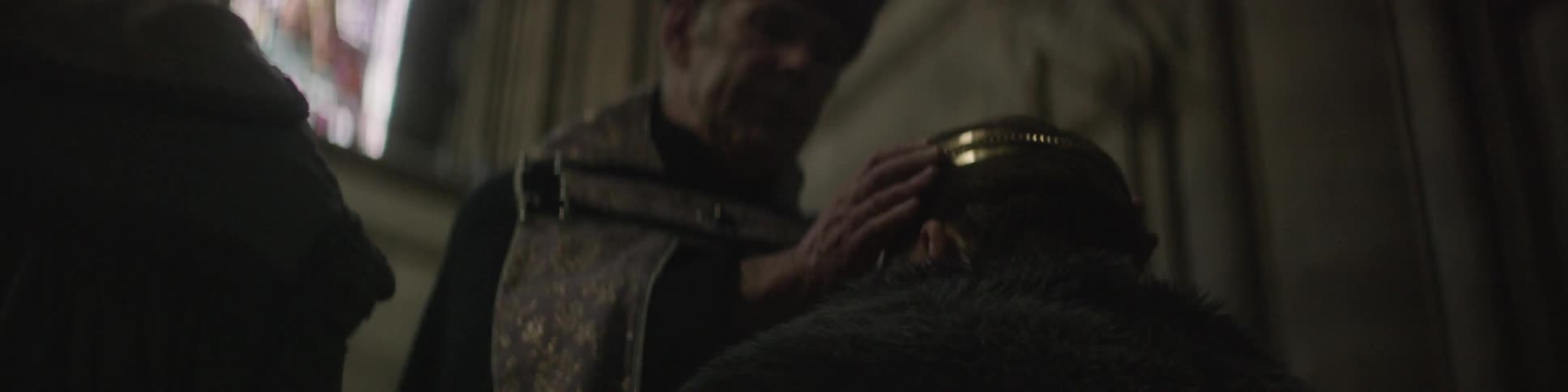 A man is crowned by a priest