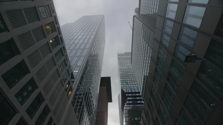 Shot of buildings downtown shooting up in overcast conditions from the street