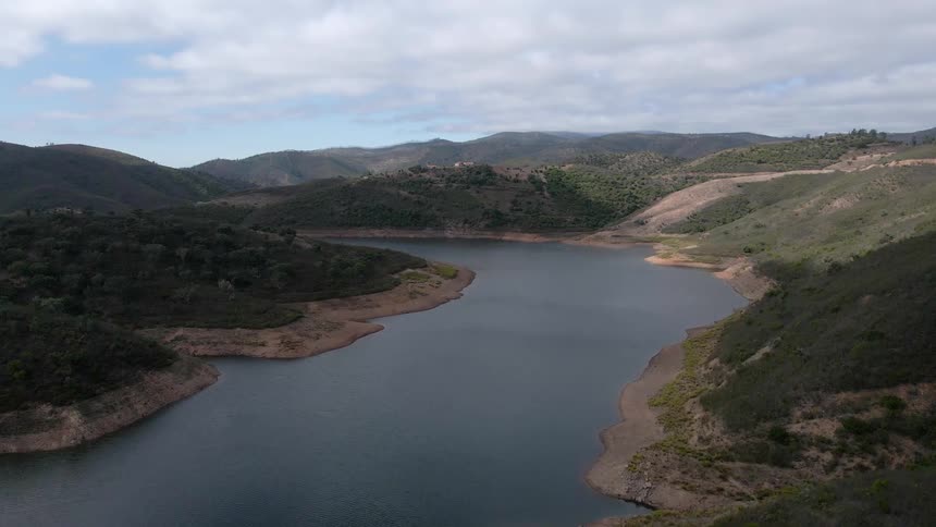 A calm river runs between land that makes up an archipelago