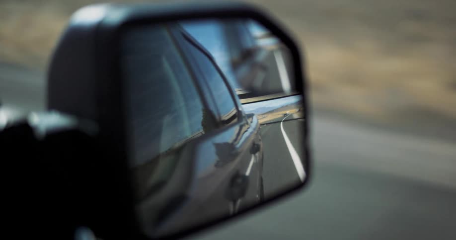 A vehicle drives down a road