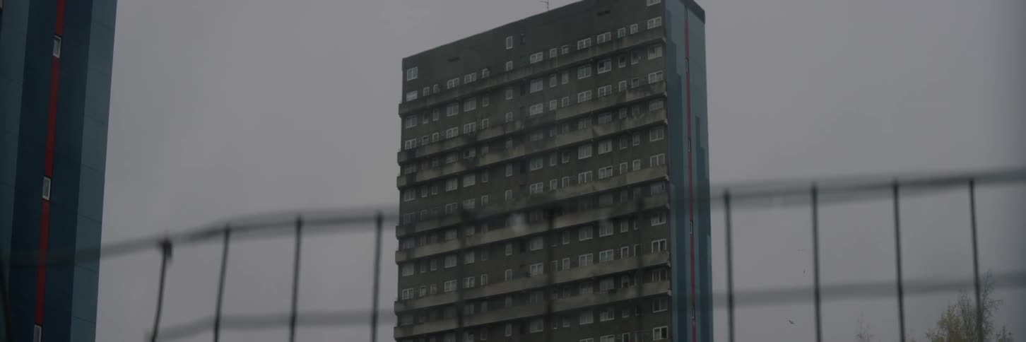 View of a tall apartment building on a cloudy day