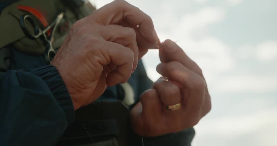 A person ties a knot