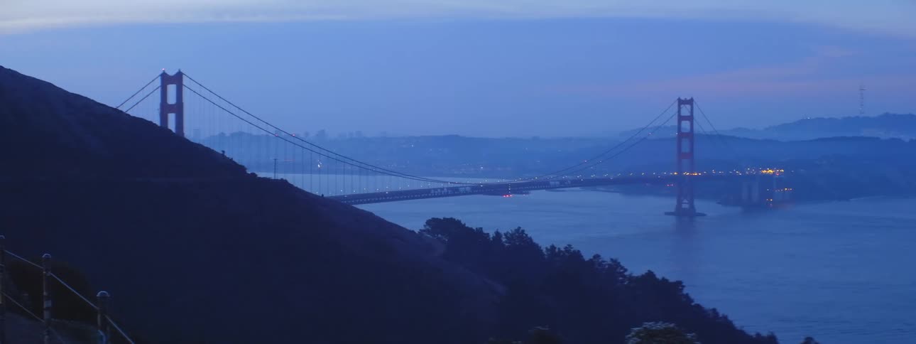 Heavy traffic travels on the golden gate bridge in san francisco at dusk