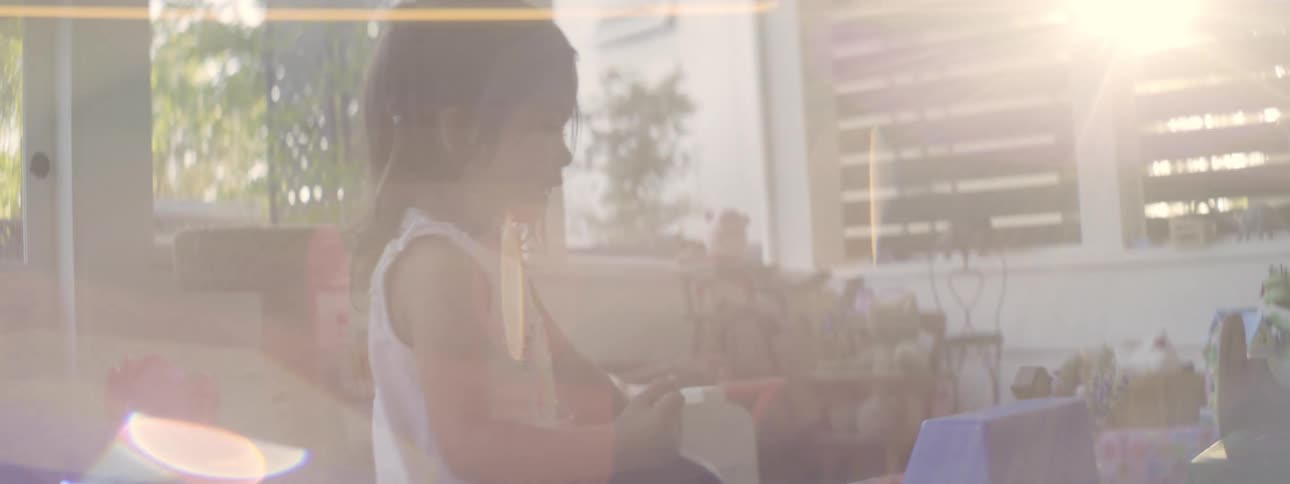 Little girl playing with toys in a toy room during the day