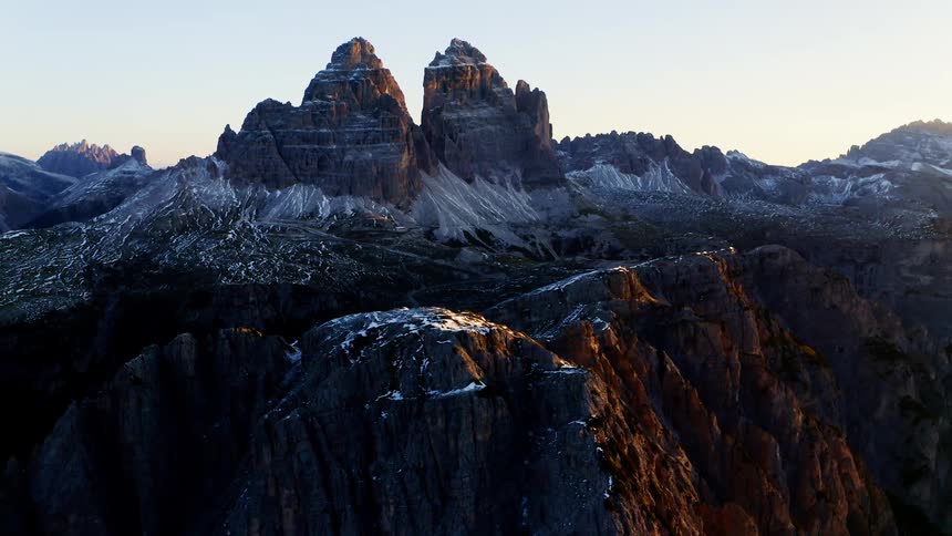 Mountain view with ice and snow and a low sun