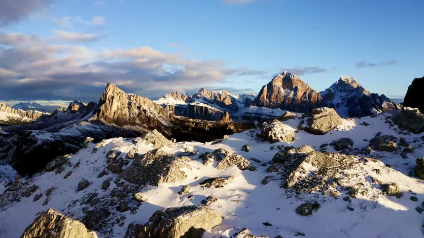 An aerial view of a snow covered mountain range