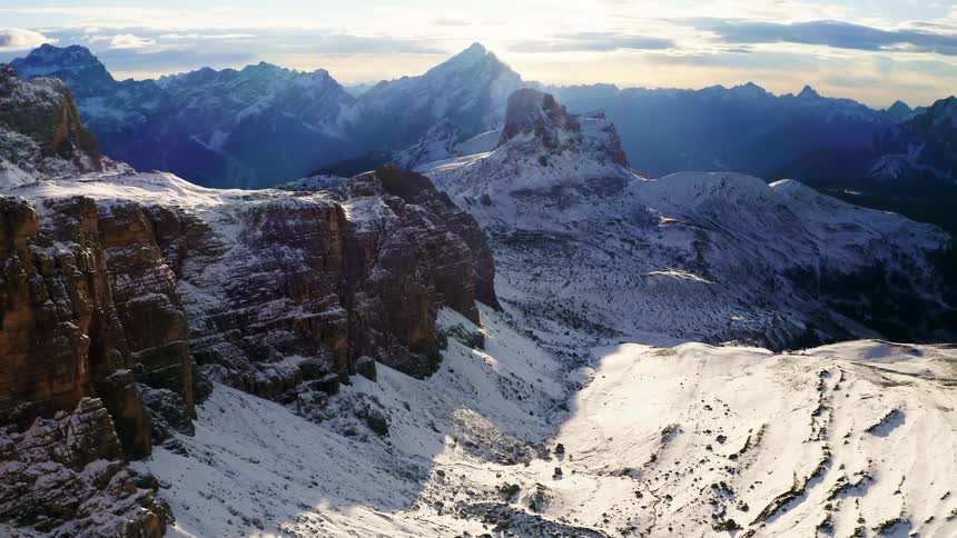 Snow covered mountain canyon and mountain peaks