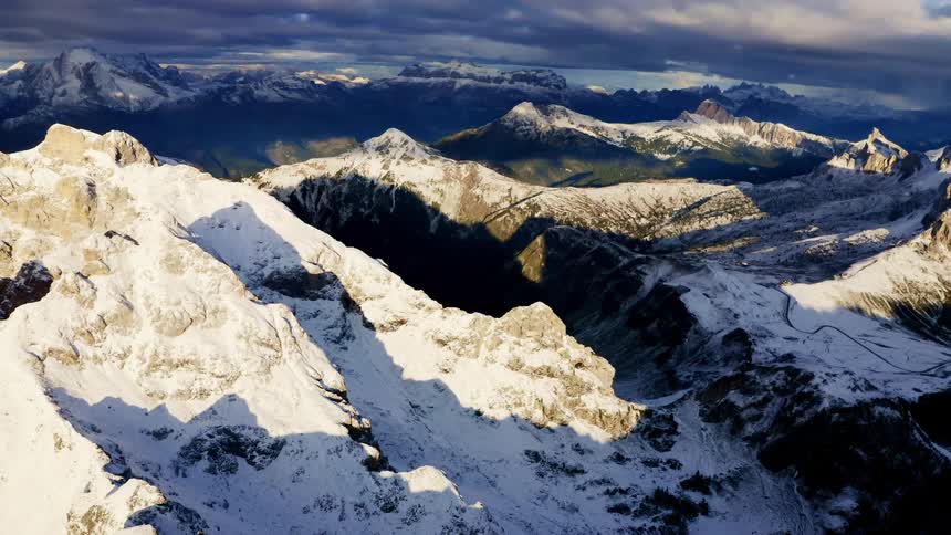 An aerial view of a snow covered mountain range