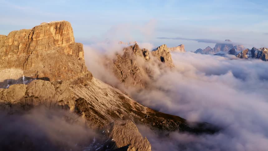 Aerial view of rugged mountains in clouds