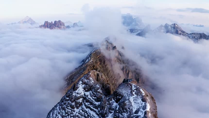 Mountain peaks high above the clouds