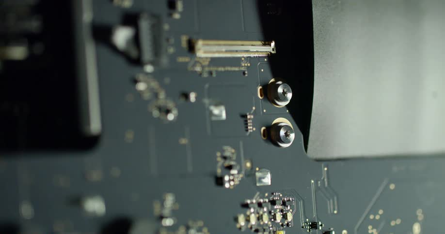 Sharp close up of a black component or circuit board fading to blurry