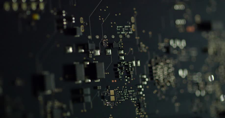 Close up of a computer or electrical board with metal components