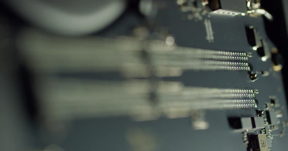 A closeup of a circuit board details a number of transistors and components