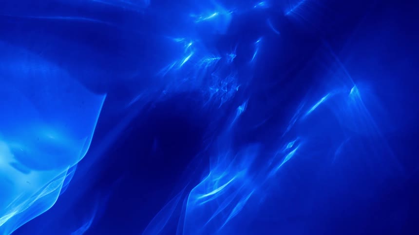 Extreme close up of something bright blue with streaks of white