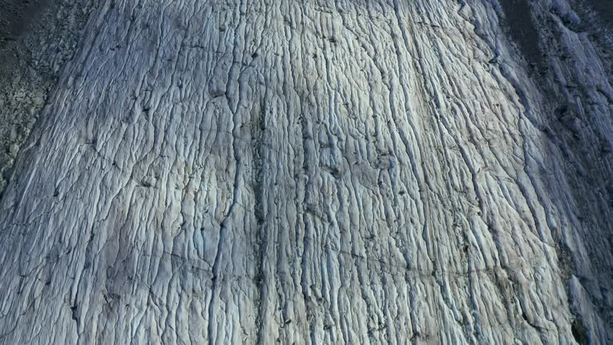 White terrain is textured with crevices