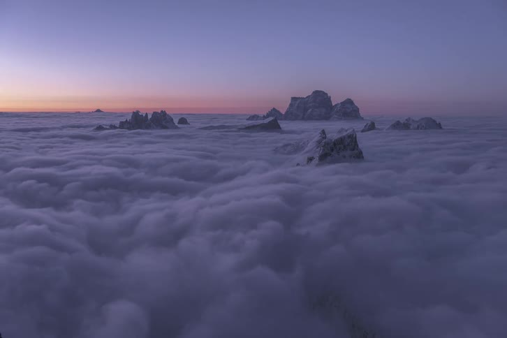 Time lapse of clouds moving over mountain peaks