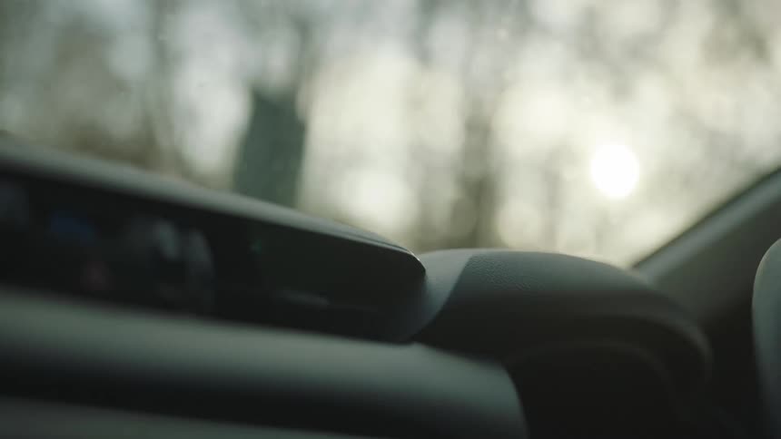 A car driving in the rain