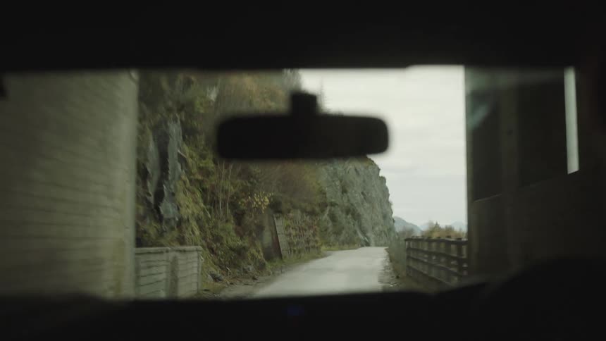 A man driving his vehicle through a tunnel