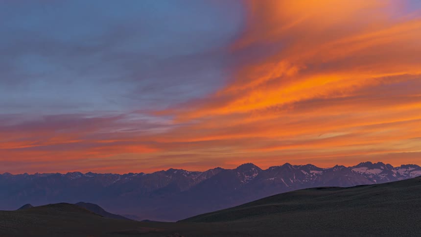Landscape and aerial view of mountains with the sky changing color from the sun