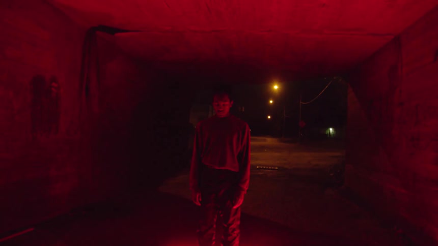 A man stands in a flashing light