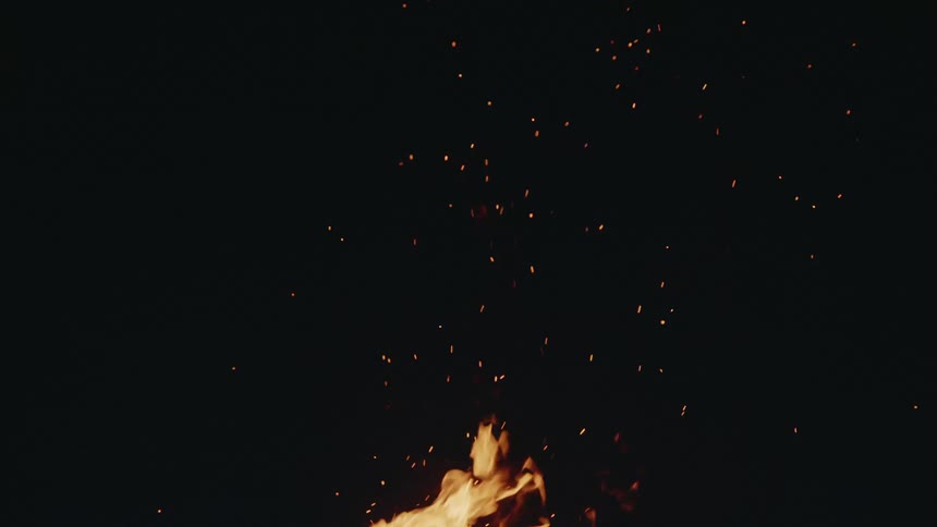 Orange flames and embers against black