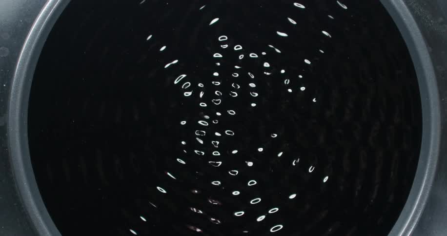 Water spins faster and faster in a centrifuge
