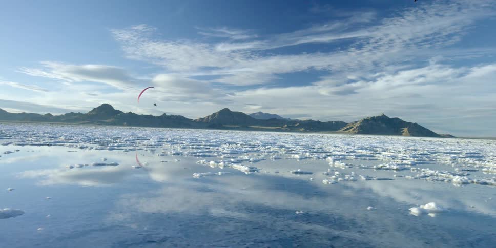 A person parasailing above water