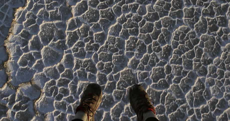 View of persons feet as they hover over the ground