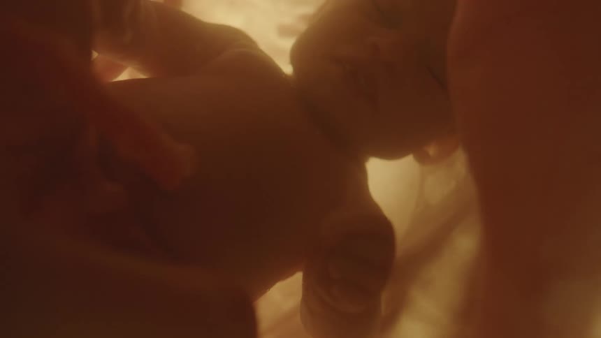 A fetus floating in utero