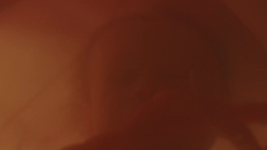 Baby with the umbilical cord connecting the baby to its mother in mothers womb