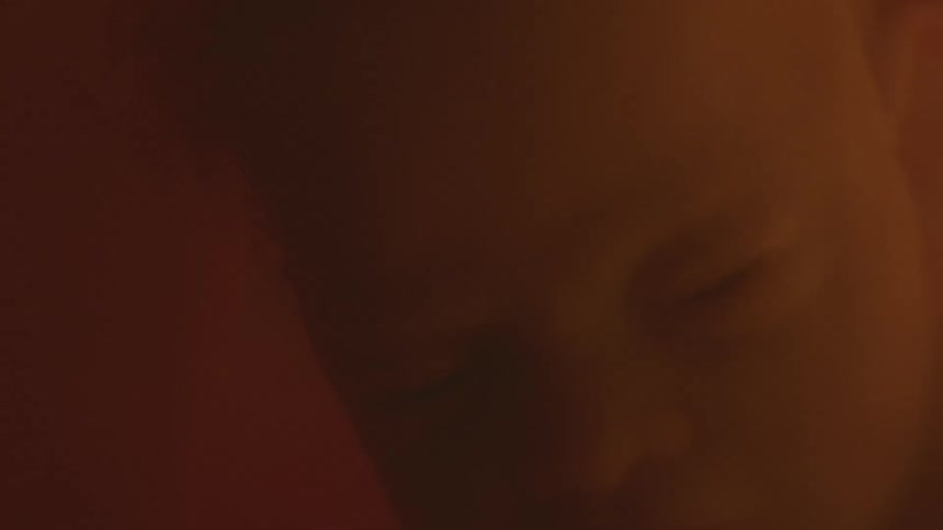 Unborn babys head in mothers womb