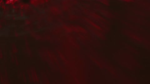Red liquid moving with ripples
