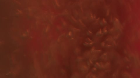 Liquid moving rapidly with bubbles and flashing red and white light