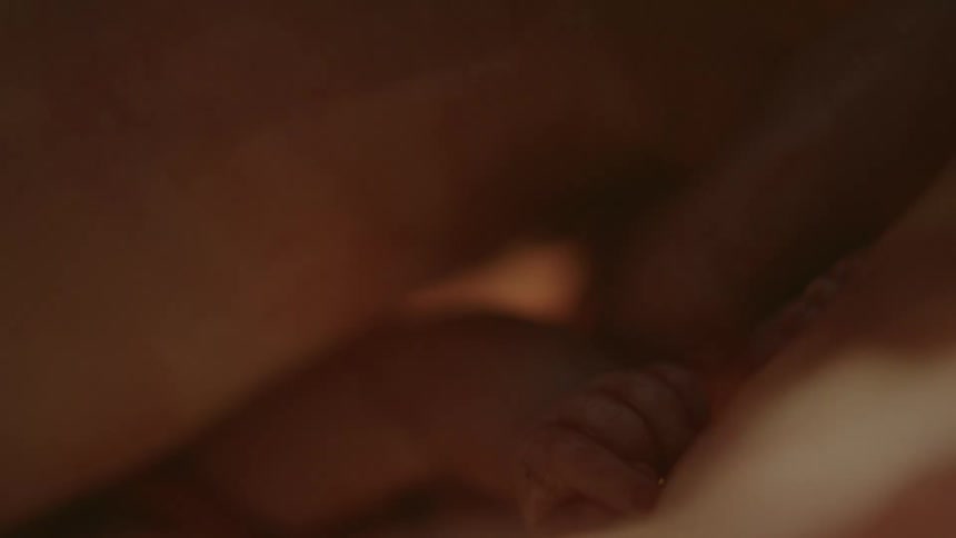 Close up of an unborn human baby floating inside the womb